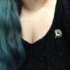 Duckiecorn pin worn on a shirt